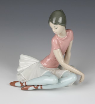 A Lladro figure of a seated ballet dancer 1357 17cm 