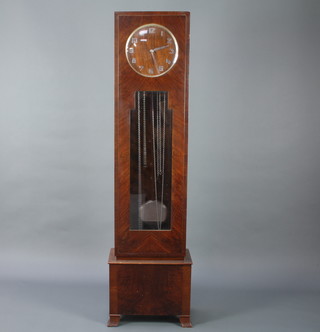 An Art Deco 8 day chiming longcase clock with 30cm figured walnut dial with silver Arabic numerals, contained in a walnut case enclosed by a glazed panelled door 185cm 