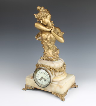 An Edwardian French 8 day striking mantel clock, the 8cm porcelain dial with Arabic numerals, garland swags, contained in a reeded marble and gilt painted case surmounted by a figure of a lady 