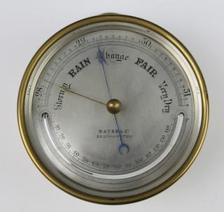 Bates & Co. Southampton, a Victorian aneroid barometer with silvered dial contained in a brass drum case 12.5cm
