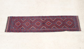 A red and blue ground Meshwani runner with 6 diamonds to the centre 268cm x 62cm 