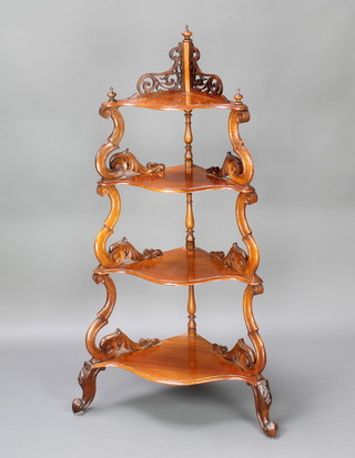 A Victorian Continental mahogany 4 tier graduated what-not with pierced panelled decoration, raised on cabriole supports 135cm h, bottom tier 39cm w x 67cm d, top tier 24cm x 50cm 