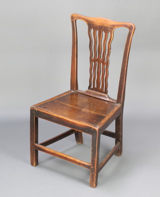 An 18th/19th Century elm slat back dining chair with solid seat, raised on square tapered supports 