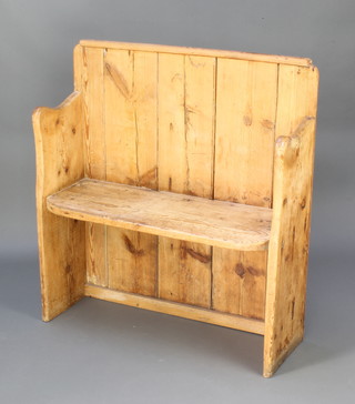 Of Horsham interest, a pine settle removed from the Jolly Ploughboy Public House Bishopric Horsham, the reverse with copper plaque marked "This seat was part of the bar at the Jolly Ploughboy Pub, Bishopric Horsham, demolished 1970" 99cm h x 92cm w x 28cm d 