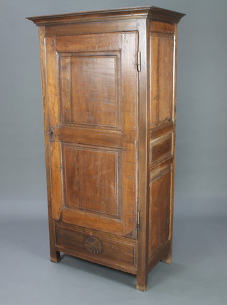 A 17th/18th Century Continental oak cabinet with moulded cornice, fitted shelves enclosed by panelled doors with an iron lock 175cm h x 89cm w x 52cm d  