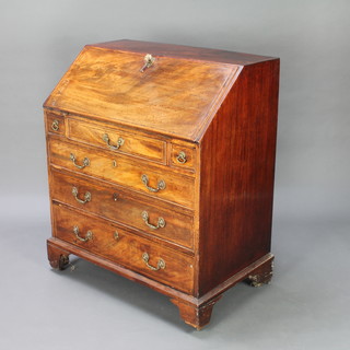 A George III inlaid mahogany bureau, the fall front revealing a fitted interior with well above 2 short and 3 long drawers, raised on bracket feet, 106cm h x 90cm w x 45cm d 