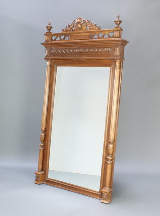 A 19th Century French rectangular bevelled plate wall mirror contained in a carved walnut frame supported by fluted columns 173cm h x 97cm w
