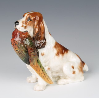 A Royal Doulton figure of a seated cocker spaniel with pheasant in his mouth HN1028 18cm 