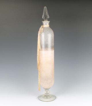 A clear glass cylindrical apothecaries bottle and stopper 54.5cm 