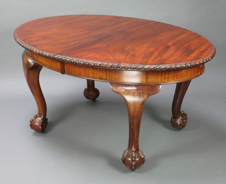 An Edwardian Chippendale style mahogany oval extending dining table with gadrooned border raised on cabriole, ball and claw supports together with 1 extra leaf and winder 76cm h x 106cm w  x 145cm when closed x 171cm  when open 
