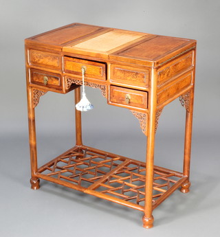 A 20th Century Chinese "figured walnut" and hardwood enclosed wash stand, the centre section with hinged lid fitted a mirror flanked by a pair of recesses and fitted trays and having 1 long drawer above 2 short drawers, raised on square tapered supports and with fretted panel decoration to the sides 80cm h x 71cm w x 43cm d  