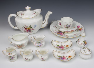 A Royal Crown Derby, Derby Posies tea set comprising tea pot (red mark), 12 tea cups (red), 6 saucers (red), 6 saucers (green mark), 1 milk jug (red), 1 cream jug (red), 3 cream jugs (green) 1 strainer and stand (red), 2 sugar bowls (red), 1 sugar bowl (green), 6 small plates (red), 6 small plates (green), 1 sandwich plate (green), 12 large plates (red), 2 dishes (red), 1 small dish (green), 1 mustard pot (red) and pepper (red) 