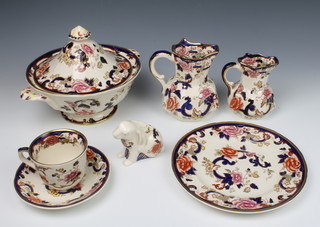 A Masons Mandalay pattern part tea and dinner service comprising 10 tea cups, 10 saucers, 1 coffee cup (crazed), 6 small plates, 8 medium plates, 6 dinner plates, 6 dessert bowls, 2 jugs, a tureen and cover, a dish, a sandwich plate and a figure of a rabbit 