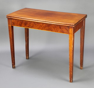 A 19th Century rectangular inlaid mahogany tea table raised on square tapered supports 75cm h x 90cm w x 44cm d 