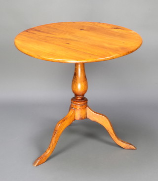 A 19th Century circular mahogany snap top tea table, raised on a turned column and tripod base 70cm h x 74cm diam. 