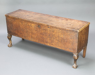 An 18th/19th Century oak coffer of plank construction with hinged lid, raised on later cabriole supports 54cm h x 48cm w x 35cm d 