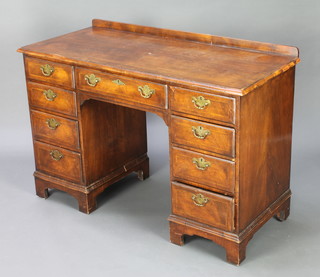A Queen Anne style walnut desk/dressing table with raised back having a quarter veneered and crossbanded top fitted 1 long and 8 short drawers, raised on bracket feet 79cm h x 115cm w x 50cm d 