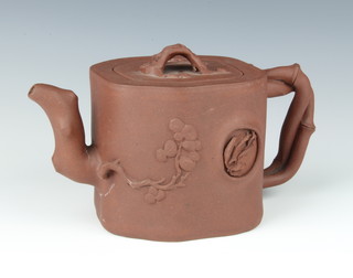 A 19th Century Chinese tanware teapot with rustic handle, the body decorated with prunus 10cm 
