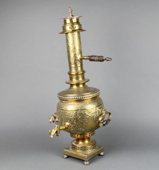 An Indian twin handled brass samovar of baluster form raised on bun feet 63cm h x 20cm diam.  