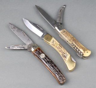 3 large pocket knives including a horn handled 2 bladed knife stamped ROBtKLAS, a hand made single blade lock back knife by Falcon and a 2 blade corkscrew lock back 
