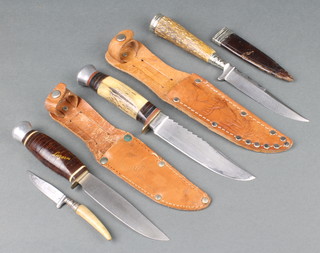 A German hunting knife with worked blade back, stag horn handle, white metal bolster and end cap, a small hunting knife and 2 sheath knives - 1 with bone handle and saw back blade 