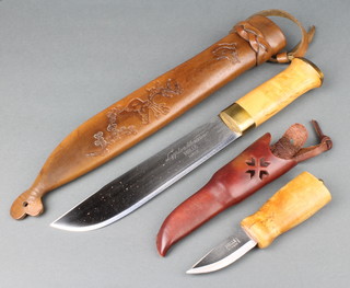 A Norwegian long camping knife, Sami people style marked Lapplandsknives Helle Norge with birch hilt, brass fittings and deep leather scabbard together with a Helle skinning knife 