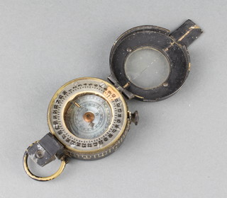 A Second World War military issue prismatic compass marked T.G.Co. Ltd London No. B 50365 1940 Mk III 