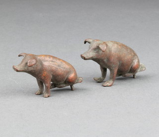 Two bronze figures of seated pigs 5cm and 4cm 