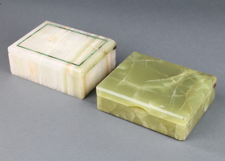 A Betjemann's patent onyx cigarette box with hinged lid 4cm x 13cm x 10cm (some chips) together with an onyx and malachite cigarette box with silver hinge 4.5cm x 13cm x 9.5cm (lid is f and r)  