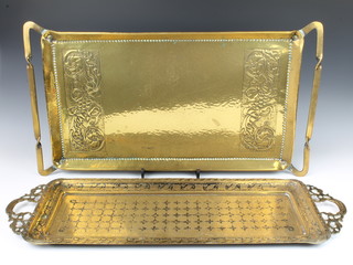A Benares brass bottle tray 73cm x 24cm together with a rectangular Art Nouveau embossed brass tray 68cm x 38cm 