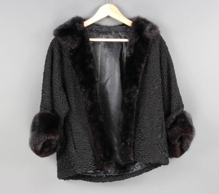 A lady's black Persian lamb quarter length jacket with fur cuffs and collar 