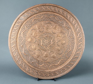 An Indian/Persian pierced and embossed copper charger decorated serpents and fish 61cm  
