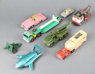 A Dinky 101 Thunderbird 2 containing Thunderbird 4, Lady Penelope's Thunderbird FABI (Lady Penelope missing), Dinky Meccano Super Toy rocket launcher and rocket (fin to rocket f), a Matchbox Kingsize no. K17 Dyson low loader, do. no. K18 articulated horse van, Britains field gun, a Solido NSU Prinz XV Type 47 car, together with a Corgi Major breakdown van
