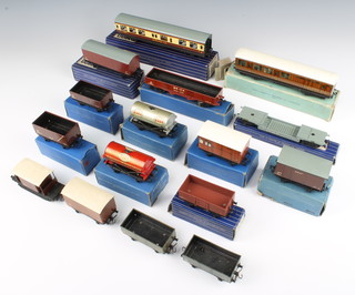 A collection of Hornby Dublo rolling stock comprising 6 items of D1 rolling stock - horse box, open wagon, petrol tank Esso, oil tank Royal Daylight, high capacity wagon, D2 high sided wagon, SD6 goods wagon, D20 composite restaurant car, D1 well wagon, a Hornby Corridor coach D1, all boxed together with 5 other items of Hornby rolling stock 
 
