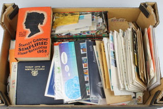 A collection of first day covers, presentation stamps, loose stamps etc