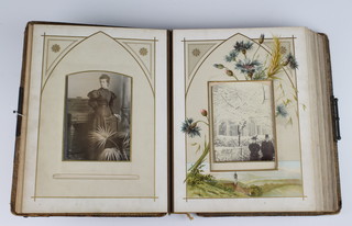 A Victorian leather bound family photograph album 
