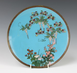 A circular blue ground cloisonne enamelled plate with floral decoration 24cm 