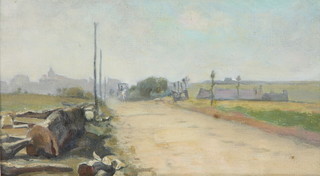 Edwardian oil on board, unsigned, a Continental roadside study with carriage and distant buildings, 12cm x 21cm 