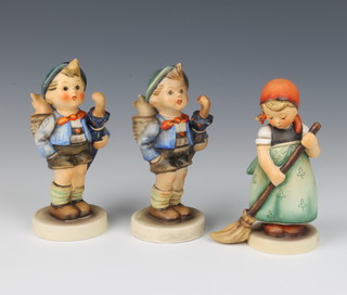 Three Hummel figures - boy with pig in basket and umbrella 198 13cm, Little Sweeper 12cm and another boy with pig in basket and umbrella 198 12cm 