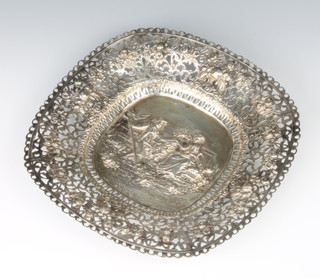 A 19th Century Continental repousse and pierced silver dish decorated with a fete galante view enclosed by roses 800 standard,  234 grams 22cm