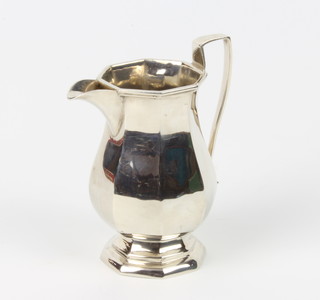 An octagonal silver baluster cream jug, London 1946, 10.5cm, 134 grams  