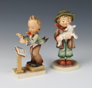 Three Goebel figures  - The Log Sheep 68/0 14cm, a Chorister no.129 14cm and 1 other boy singer 