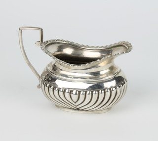 A Victorian silver cream jug with demi-fluted decoration Chester 1895, 84 grams, 11 cm 
