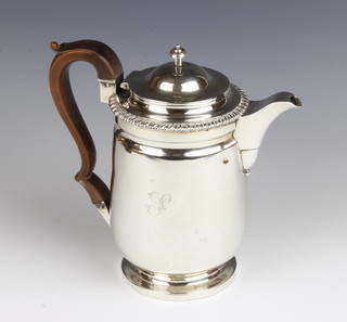 Paul Storr, a George IV silver coffee jug with gadroon rim and tapered body, having S scroll fruitwood handle, London 1822, maker Paul Storr, gross 762 grams, 20cm high 