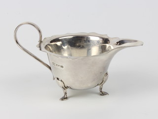 A silver sauce boat with cut rim on pad feet, Sheffield 1931, 106 grams 
