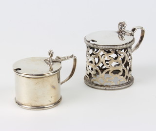A Victorian pierced silver mustard holder, London 1858 together with a plain cylindrical ditto Birmingham 1911, 208 grams 