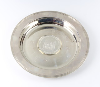 A silver Armada dish with coin set insert, 123 grams, London 1978, 13cm  