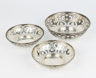 Three silver dishes with pierced scroll decoration, Chester 1908, 201 grams