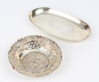 An oval silver shallow dish Sheffield 1907, 16 cm together with a pierced and repousse silver bon bon dish 11.5cm 154 grams 
