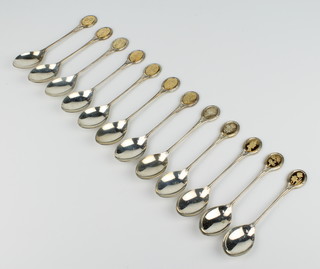 A set of 12 silver teaspoons with floral gilt handles, Sheffield 1974, 305 grams
